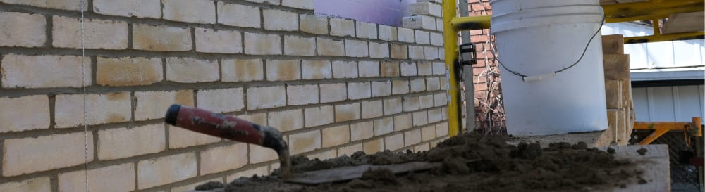 A brick house is being made.