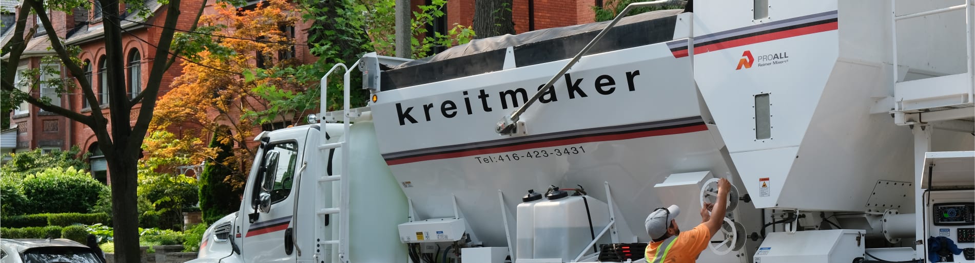 Wall with multiple brick samples and TV screen that says kreitmaker.