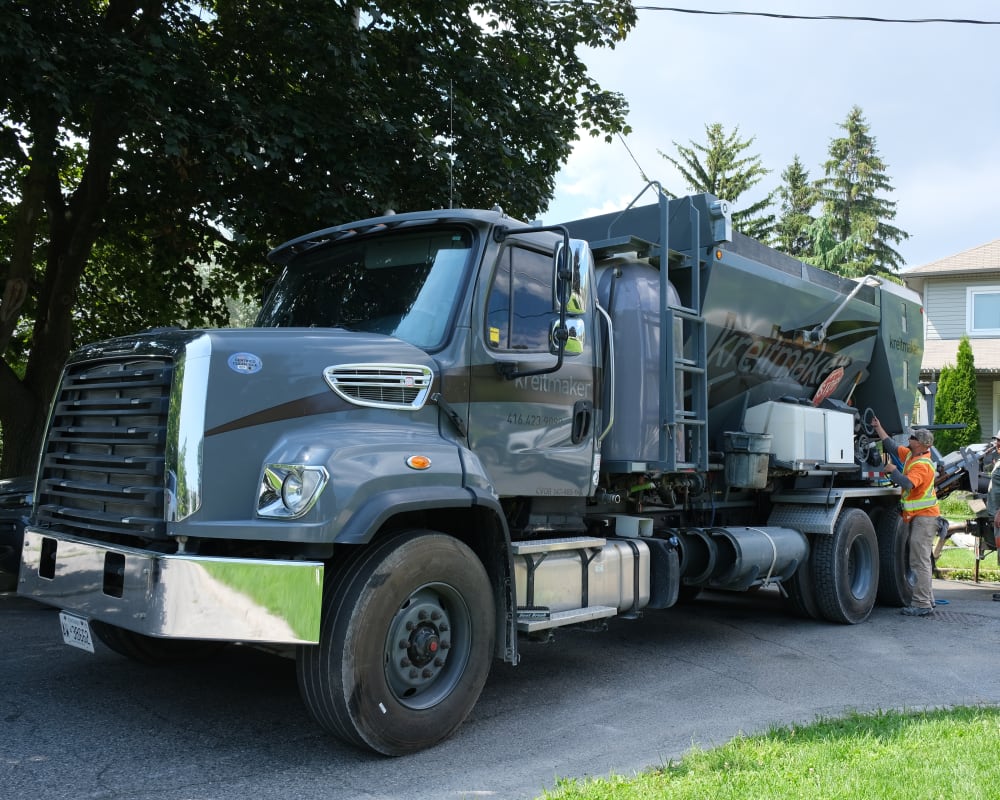 Grey concrete truck with kreitmaker logo.